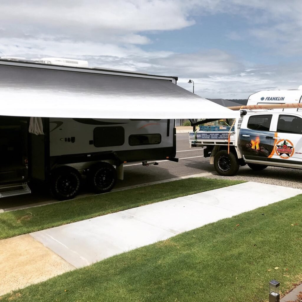 New roll-out awning fitted to a dual axle caravan by Queensland Mobile Caravan Services